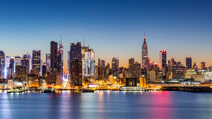 New York City skyline at dawn, as viewed from Weehawken, along the 42nd street canyon