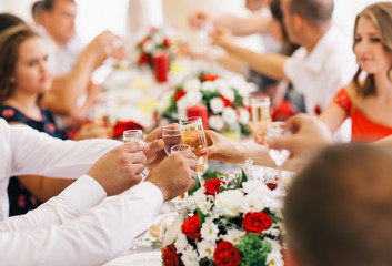 Holiday Event people cheering each other with champagne.