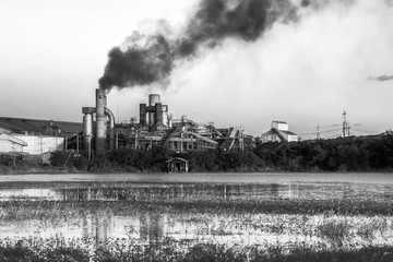 Fototapeta na wymiar Chemical factory with smoke stack black and white tone