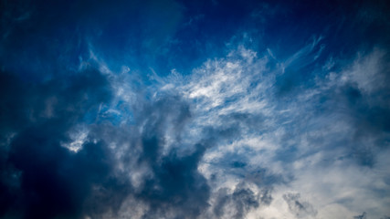 Dramatic sky with white clouds.