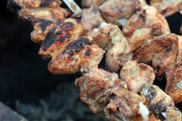 Chicken on the grill to cook