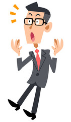 眼鏡をかけたビジネスマンが驚く