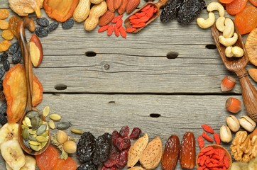 Mix of dried fruits and nuts - symbols of judaic holiday Tu Bishvat. Copyspace background.Top view.