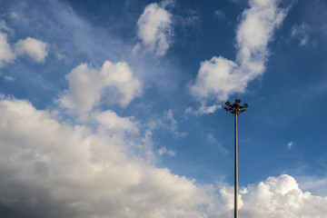 spotlight post (high mast) on sky,black and white cloud backgrou