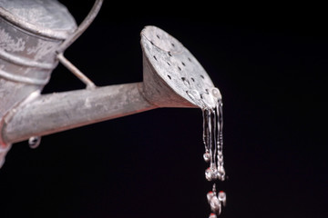 dripping watering can