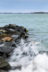 Waves Crash against a Rockwall