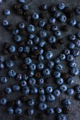 fresh blueberry and blackberry on black background