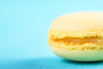 Yellow Lemon French Macaroon On Blue Background