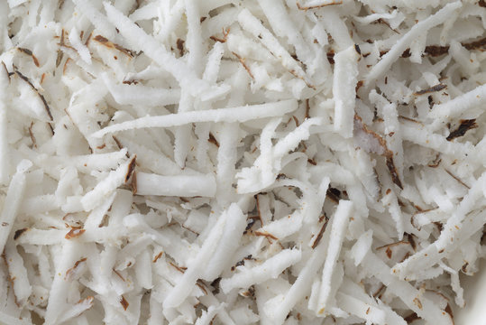 Grated Coconut / High resolution close up of freshly grated coconut shot in studio
