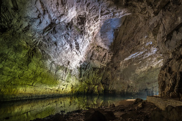 Underground river passing a dome in Planina Cave