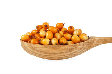 Sea buckthorn berries in wooden spoon on a white background