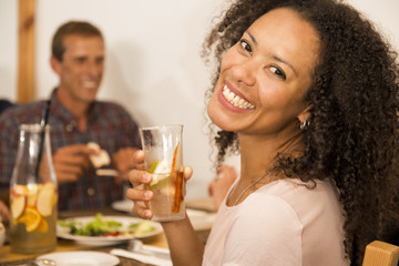 Afro-american woman having a drink