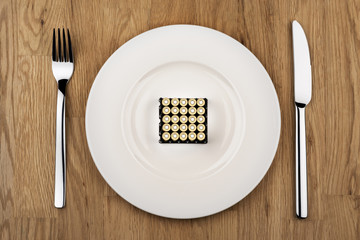 pistol cartridges on plate