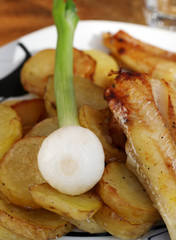 cooked and oily  golden yellow french fried potatoes 