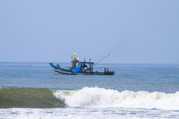 Obraz premium fishing vessel goes to the sea with networks