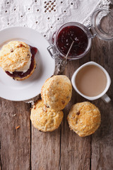 Delicious English scones with jam and tea. vertical top view
