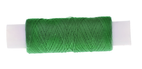 spool of green thread isolated on white