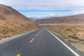 Landscape of Karakul lake, in Xinjiang province of China lies on the Karakoram Highway linking Kashgar in China with Islamabad in Pakistan. It's in the Pamir mountain range.