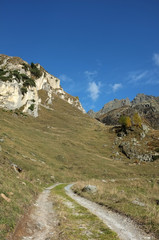 Dirt road on a beautiful high mountain scene
