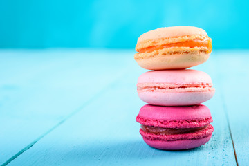 Colorful French Macaroons On Blue Background