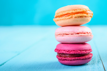 Colorful French Macaroons On Blue Background