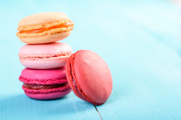 Colorful French Macaroons On Blue Background