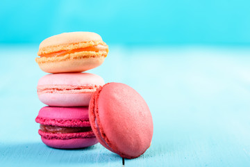 Colorful French Macaroons On Blue Background