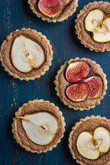 whole wheat tarts  with chocolate frangipane, figs, apple and pe