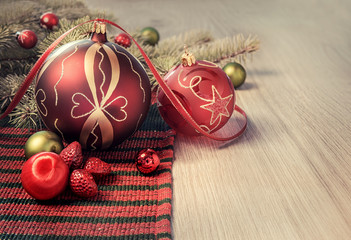 Christmas toys and decorations on wooden table, text space