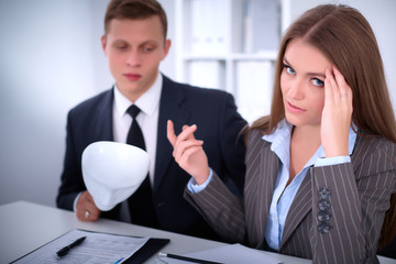 A group of business people at a meeting . They do not hear me, they dont want to understand me, business concept