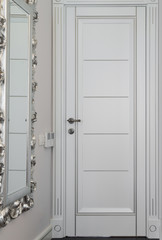 Fototapeta premium White wooden door in modern apartment