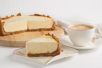Cheesecake and coffee on a white background