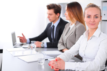Group of Business people at meeting, focus on blond business woman