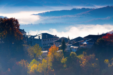 Fototapeta premium autumn scenery up early with fog in Zagorochoria, Epirus Greece