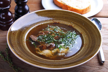 soup with meat and greens with egg