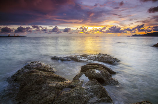 sunrise at rocky beach in terengganu, malaysia. image taken with