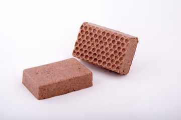 Soft handmade soap-scrub with cocoa and coffee on light gray background