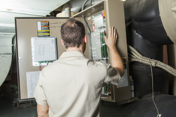 Fototapeta na wymiar Air Conditioner Repair Man at work