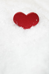 Obraz premium Red Heart Upright in White Snow