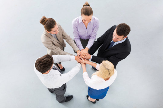 Business People Holding Hands To Form A Circle