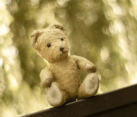 Cute vintage toy bear in sepia tone