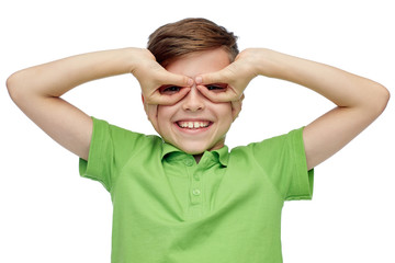 happy boy in t-shirt having fun and making faces