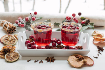 Cranberry drink. Winter mood on the window sill. Winter theme.