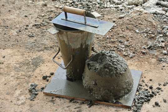 The slump test equipment. Wet concrete was compacted for the slump test. 