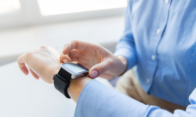 close up of hands setting smart watch