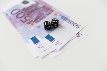 Fototapeta na wymiar close up of black dice and euro cash money