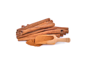 Cinnamon sticks  and powder on white background