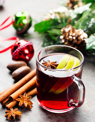 Mulled red wine with apple slices and spices