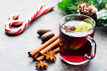 Mulled red wine with apple slices and spices