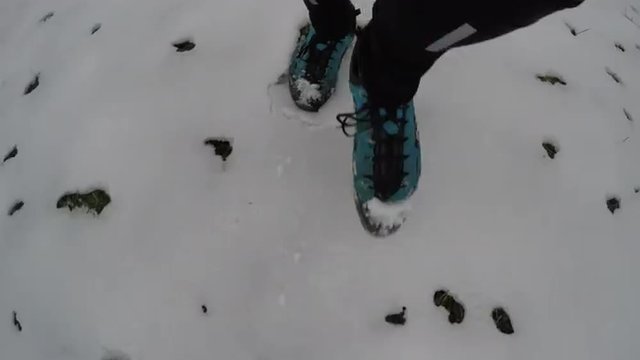 Man running in snow in winter